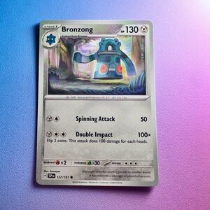 bronzong - 127/191 (common) — pokemon: surging sparks